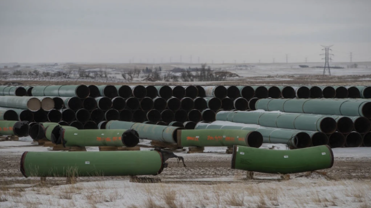 Pipes for the Keystone XL pipeline stacked in a yard near Oyen, Alberta, Canada, on Tuesday, Jan. 26, 2021. U.S. President Joe Biden revoked the permit for TC Energy Corp.'s Keystone XL energy pipeline via executive order hours after his inauguration.