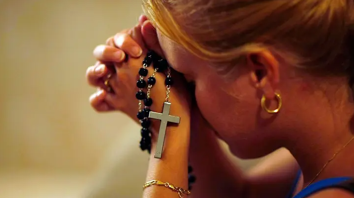A woman prays at St. Brendan Catholic Church's Adoration Chapel September 21, 2007, in Miami, Florida.
