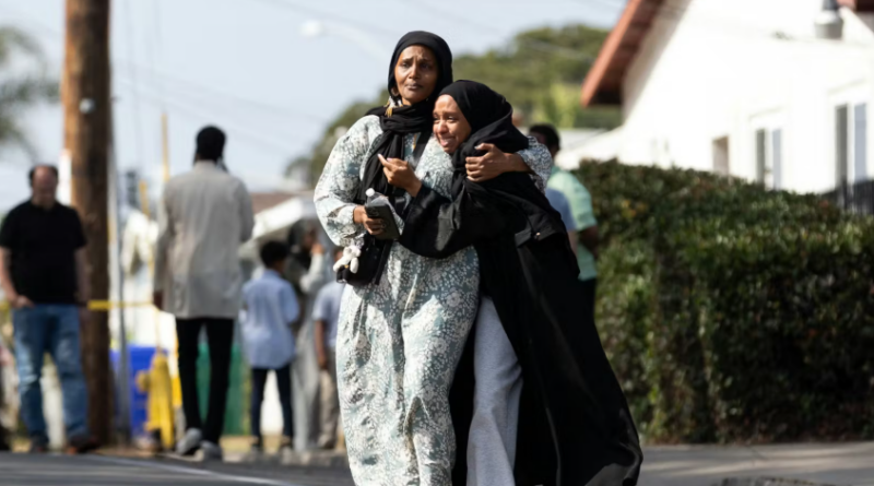 Two women cry as they leave a reunification center following the shooting at the Islamic Center of San Diego in southern California, on May 18, 2026. A shooting at the largest mosque complex in San Diego killed three people, with two suspected teenage gunmen later found dead in a car from self-inflicted gunshot wounds, police said.