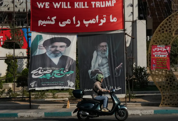 Iranian officials have distributed banners calling for Trump’s assassination.