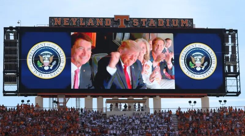 President Trump is shown on the video board in attendance at Neyland Stadium before a game between the Texas Longhorns and Tennessee Volunteers in Knoxville, Tennessee