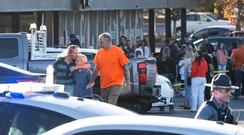 People leave a family meeting area following a shooting at Silver Rail Elementary School on Friday in Bend, Oregon